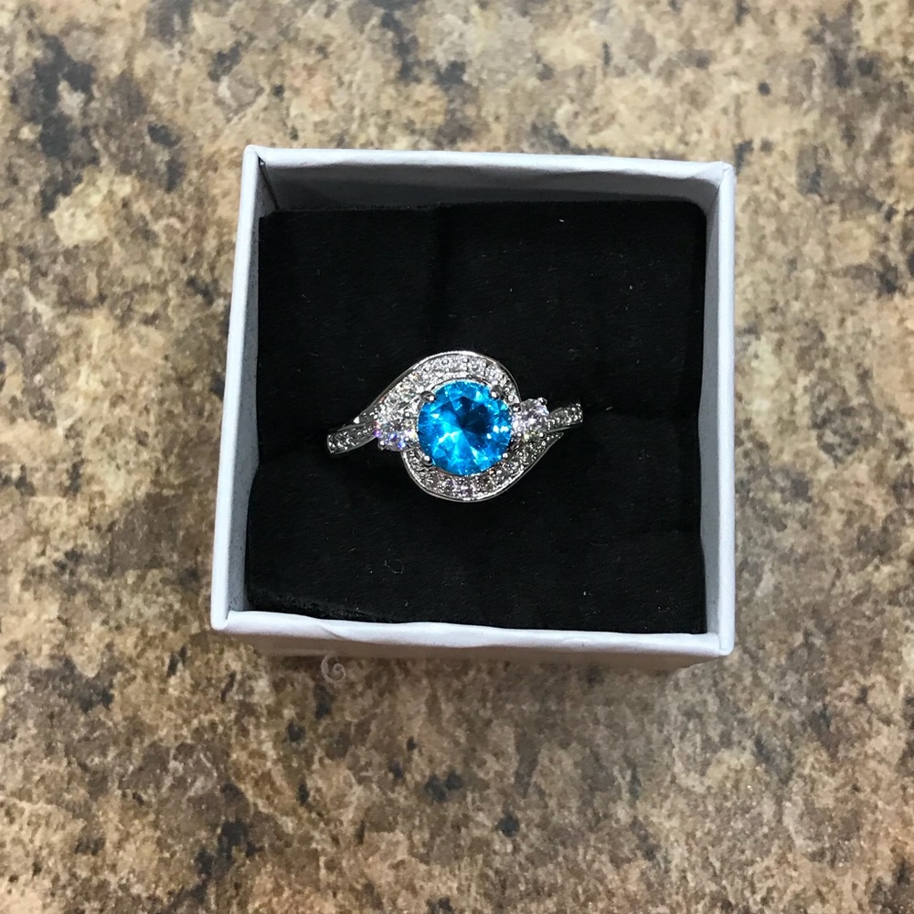 Blue topaz Ring with white cz diamonds
